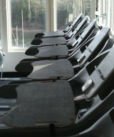 rows of treadmills lined up next to each other in front of a window