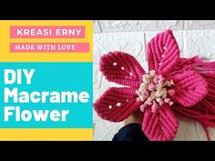 a knitted pink flower with text overlay that reads, kreasi envy made with love