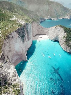 an aerial view of the blue waters and cliffs in zakyb island, turkey