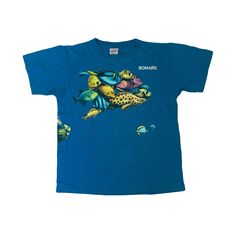 Vintage 90s Bonaire Caribbean island souvenir nature tropical fish print blue quirky single stitch t-shirt size large Pit to pit: 22" Collar to hem: 28" Fish Shirt Aesthetic, Vintage Print Beach Shirt, Blue Short Sleeve Top With Fish Print, 90s Graphic Print Tops For Surfing, 90s Graphic Print Surfing Tops, Fish Shirt, Graphic Fish Print T-shirt With Short Sleeves, T Shorts, Tropical Shirts