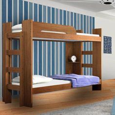 a wooden bunk bed sitting in a bedroom next to a blue and white striped wall