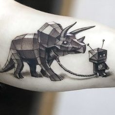 the arm is decorated with an origami style bull and elephant on it's left side