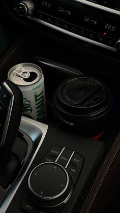 the interior of a car with an automatic drink holder