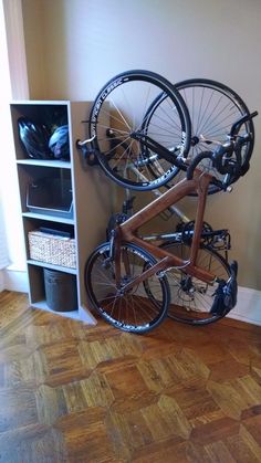 there is a bike mounted to the wall in this room with other bikes on it