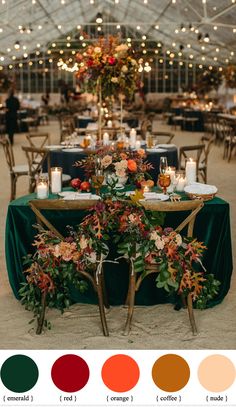 the table is set with candles, flowers and greenery for an outdoor wedding reception