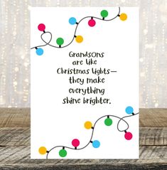 a christmas card that says grandsons are like christmas lights they make everything shine brighter