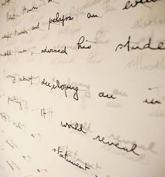 the writing on the wall is written in cursive and handwritten scripts