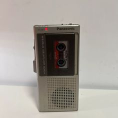 an old fashioned cassette player sitting on top of a table