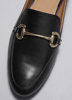 Equestrian Buckle Loafers - Black - Loafers - & Other Stories US Luxury Loafers With Metal Pin Buckle For Work, Luxury Calf Leather Loafers With Flat Heel, Luxury Loafers With Metal Pin Buckle For Office, Luxury Classic Loafers With Metal Pin Buckle, Women's Luxury Closed Toe Loafers, Luxury Classic Leather Shoes With Tang Buckle, Luxury Timeless Loafers For Derby, Classic Luxury Loafers For Semi-formal Occasions, Luxury Women's Closed Toe Loafers