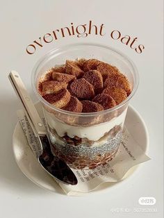 a dessert in a plastic container on top of a paper with the words overnight oats above it