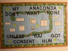 a bulletin board with information about anaconda in english and an image of a snake on it