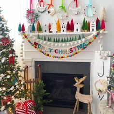 a fireplace decorated for christmas with ornaments and decorations