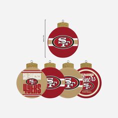 the san francisco giants ornament set is shown in red and gold, along with other ornaments