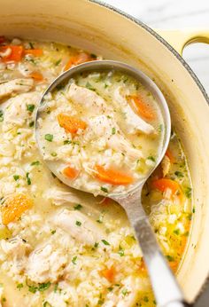 a pot filled with chicken and rice soup