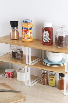 the shelves are organized with spices and condiments on them, including breadcrumbs