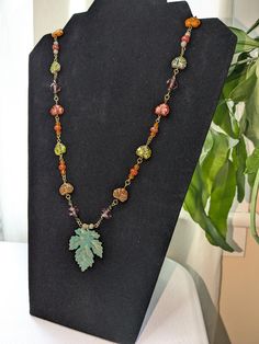 Bronze leaf with patina pendant with Czech glass leaves, and glass, crystal, and lava stone beads. Gemstones Chart, Stitch Techniques, Bead Stitch, Autumn Necklace, Earthy Jewelry, Ideas For Jewelry, Jewelry Design Inspiration, Strung Beads, Bead Stitching