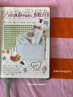 an open notebook with some paper on top of it and a bunny in the envelope