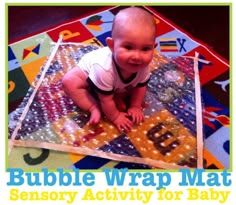 a baby crawling on top of a mat with the words bubble wrap mat in front of it