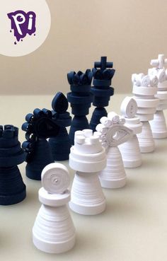 a group of plastic chess pieces sitting on top of a white table next to each other