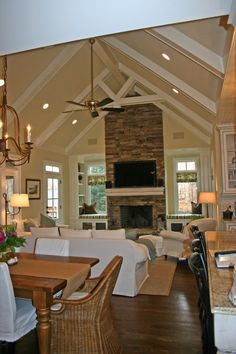 a living room filled with furniture and a fire place