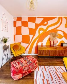 a living room with orange and white walls