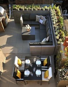 an overhead view of a patio with furniture and plants