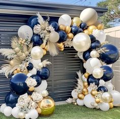 an arch made out of balloons and other decorations