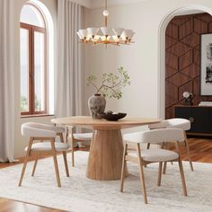 a dining room table with four chairs and a vase on the table in front of it