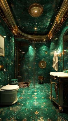 a fancy bathroom with green marble and gold accents