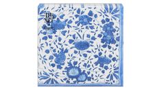 a blue and white tile with flowers on it