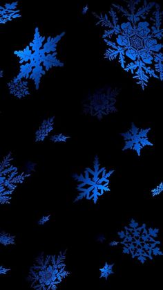 blue snowflakes against a black background