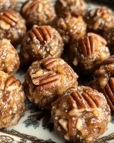 there are many pecan balls on the plate