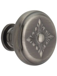 an antique style door knob with a decorative design