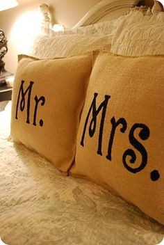 two pillows that say mr and mrs on them