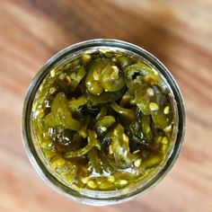 pickles in a jar on a wooden table