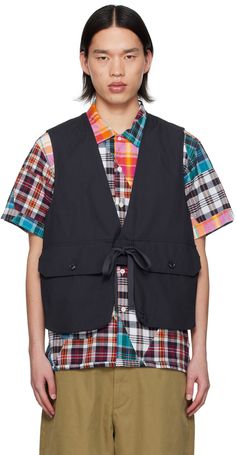 Cotton ripstop vest. · Plunging V-neck · Button closure · Drawstring at waist · Flap pockets · Modified vent at side seams · Locker loop at back collar · Kangaroo pocket at back · Unlined Supplier color: Dark navy Pocket Vest, Outerwear Vest, Engineered Garments, Dark Navy, Flap Pocket, Mens Coats, Kangaroo Pocket, Kangaroo, Apparel Accessories