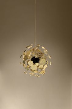 a chandelier hanging from a ceiling with many pieces of broken glass on it