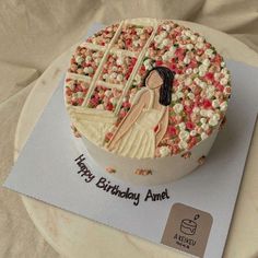 a birthday cake with an image of a woman on it