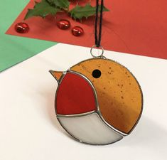 a christmas ornament with a bird on it