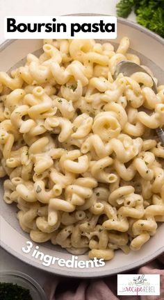 a bowl filled with macaroni and cheese on top of a table