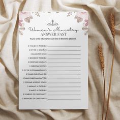 a woman's marriage answer sheet on a bed with some dried flowers in the background