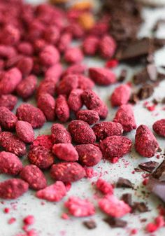 chocolate and raspberry granola on a white surface