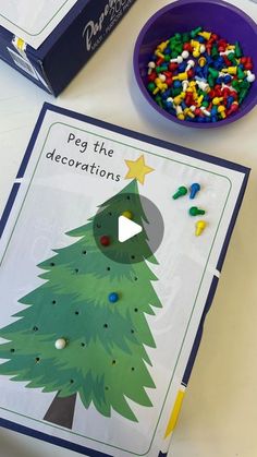 a christmas tree cut out next to a box of cereal and a bowl of candy