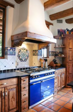 a kitchen with an oven, stove and counter tops in the middle of the room