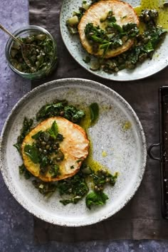 two plates filled with food on top of a table