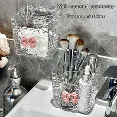 a bathroom sink filled with lots of makeup brushes