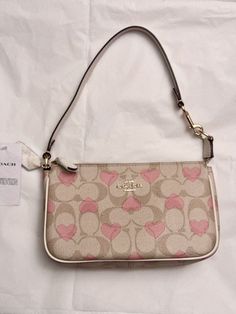 NWT Coach Nolita 19 In Signature Canvas With Heart Print CQ144 COLORS:GOLD/LIGHT KHAKI CHALK MULTI 2024 Valentine’s Day Collection Signature coated canvas and smooth leather Two credit card slots Inside multifunction pocket Zip-top closure, fabric lining Handle with 6 1/4" drop Size: 7 1/2" (L) x 4 1/2" (H) x 2" (W) Style No. CQ144 Coach Nolita 19, Outfit Ideas Pink, Coach Nolita, Pink Outfit Ideas, Nolita 19, Pink Core, Girly Bags, Girly Accessories, Signature Canvas