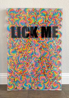 a painting with the word lock me on it in front of a white wall and floor