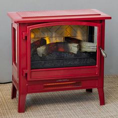 a red fire place sitting on top of a rug