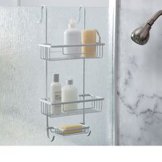 two tiered shower caddy with soap, shampoo and lotion in bathroom